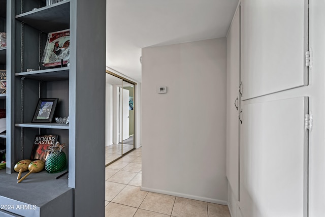 hallway with light tile floors