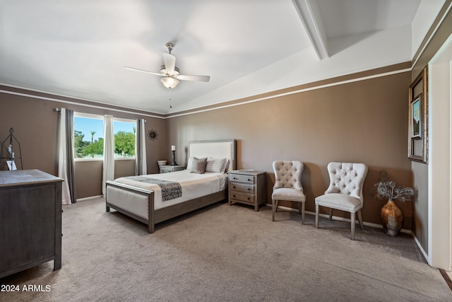 carpeted bedroom with lofted ceiling with beams, ceiling fan, and ornamental molding