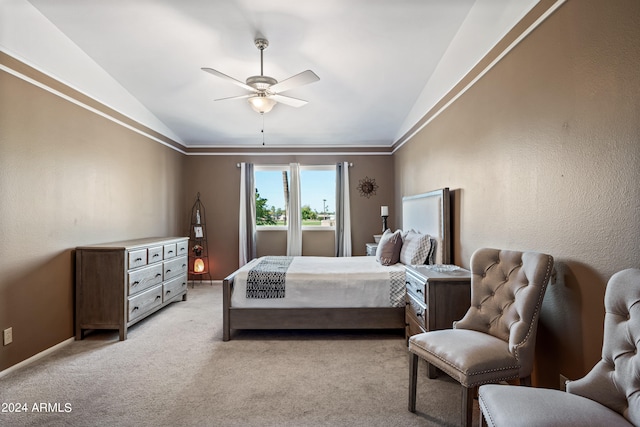 carpeted bedroom with lofted ceiling, ceiling fan, and crown molding