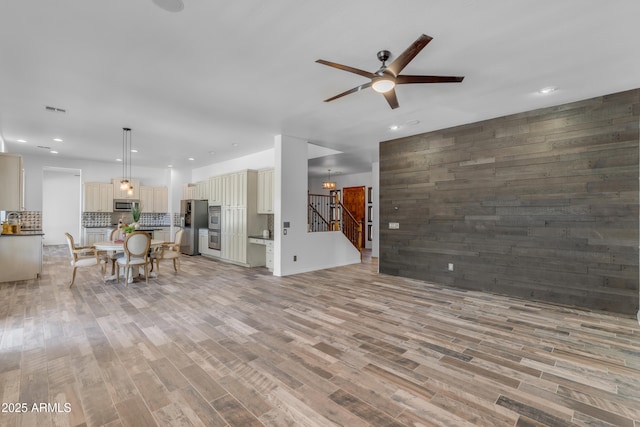 3806 E Taurus Pl, Chandler, AZ 85249 - living room with a ceiling fan, light wood-style flooring, recessed lighting, and stairs