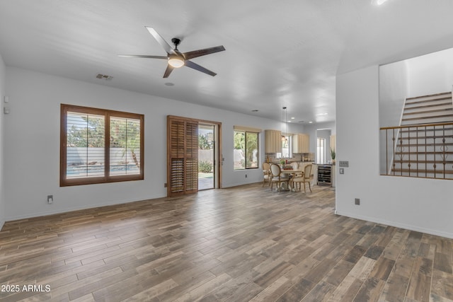 3806 E Taurus Pl, Chandler, AZ 85249 - living room with wood finished floors, stairway, and healthy amount of natural light