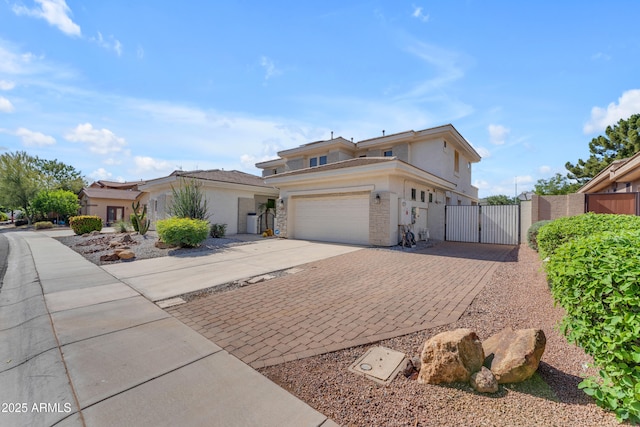 3806 E Taurus Pl, Chandler, AZ 85249 - traditional-style home featuring a gate, driveway, an attached garage, stucco siding, and fence