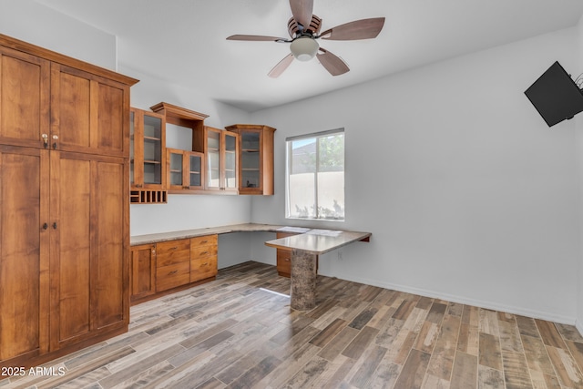 3806 E Taurus Pl, Chandler, AZ 85249 - unfurnished office featuring built in desk, light wood finished floors, and a ceiling fan