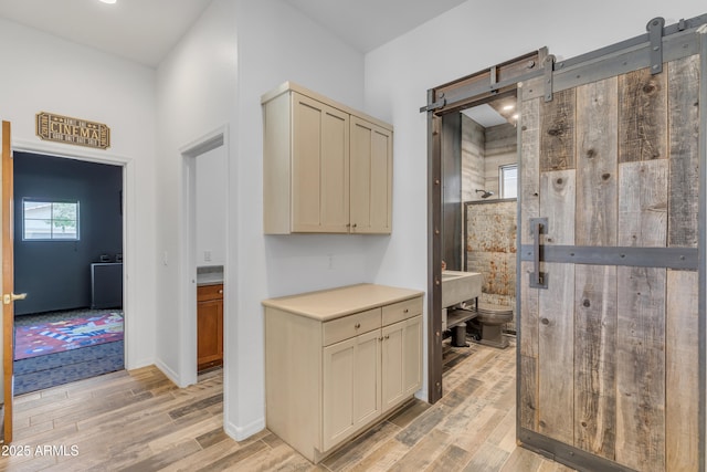 3806 E Taurus Pl, Chandler, AZ 85249 - hallway with a barn door and light wood-type flooring