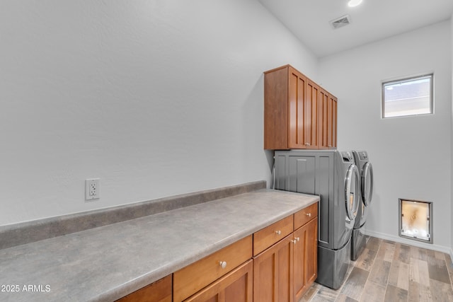 3806 E Taurus Pl, Chandler, AZ 85249 - washroom featuring independent washer and dryer, cabinet space, light wood-style flooring, and baseboards