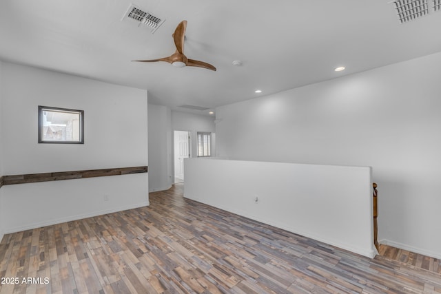 3806 E Taurus Pl, Chandler, AZ 85249 - unfurnished room with recessed lighting, plenty of natural light, and wood finished floors
