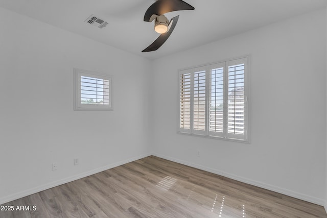 3806 E Taurus Pl, Chandler, AZ 85249 - spare room featuring wood finished floors, ceiling fan, and baseboards