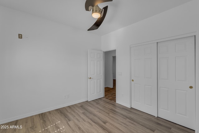 3806 E Taurus Pl, Chandler, AZ 85249 - unfurnished bedroom featuring wood finished floors, a closet, and baseboards