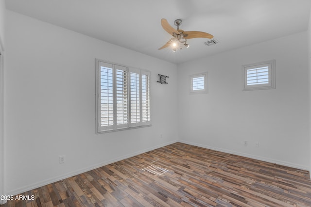 3806 E Taurus Pl, Chandler, AZ 85249 - empty room with ceiling fan, wood finished floors, and baseboards