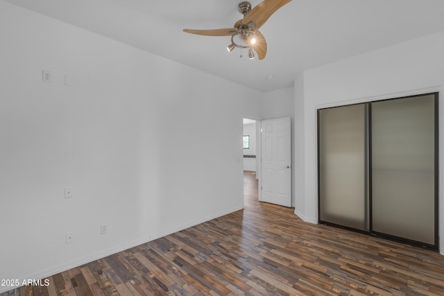 3806 E Taurus Pl, Chandler, AZ 85249 - unfurnished bedroom featuring dark wood finished floors, a closet, ceiling fan, and baseboards