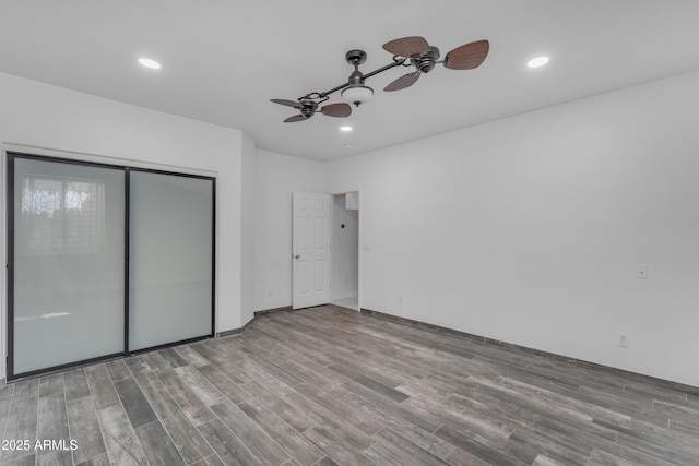 3806 E Taurus Pl, Chandler, AZ 85249 - unfurnished bedroom with wood finished floors, recessed lighting, ceiling fan, and a closet