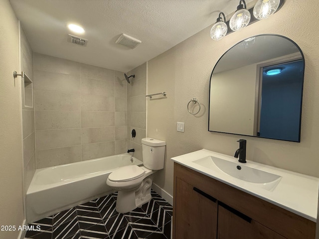 bathroom featuring visible vents, bathtub / shower combination, toilet, and vanity