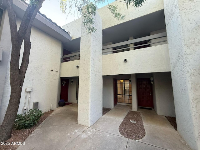 doorway to property with stucco siding