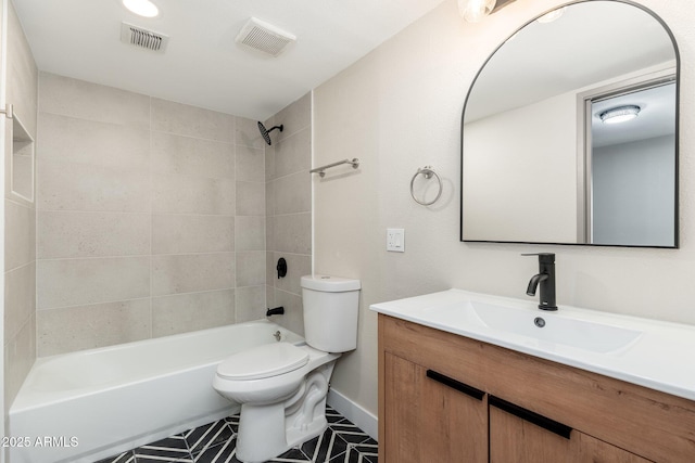 5221 N 24th St Unit 103, Phoenix, AZ 85016 - full bath with tile patterned floors, vanity, toilet, shower / washtub combination, and baseboards
