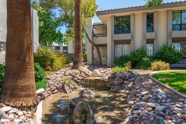 5221 N 24th St Unit 103, Phoenix, AZ 85016 - view of patio / terrace with a small pond