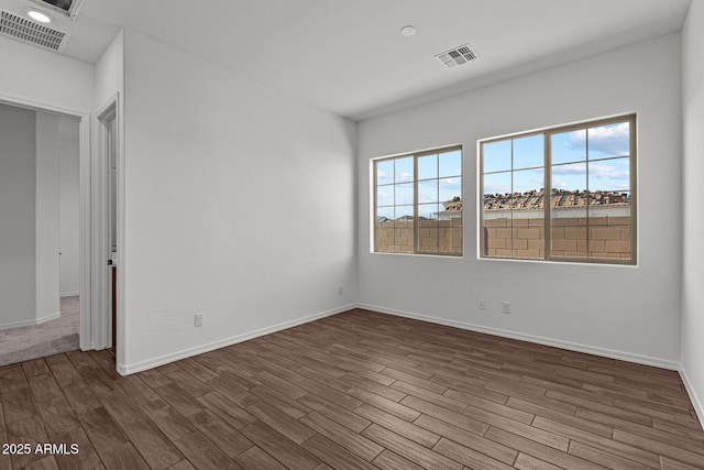12308 W Parkway Ln, Avondale, AZ 85323 - empty room with dark wood-type flooring, baseboards, and recessed lighting