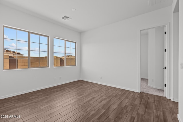 12308 W Parkway Ln, Avondale, AZ 85323 - empty room with dark wood-type flooring and baseboards