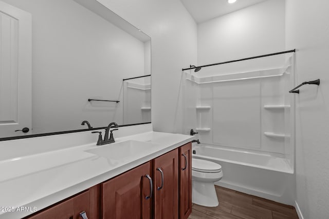 12308 W Parkway Ln, Avondale, AZ 85323 - bathroom featuring wood finished floors, toilet, vanity, shower / bathtub combination, and baseboards