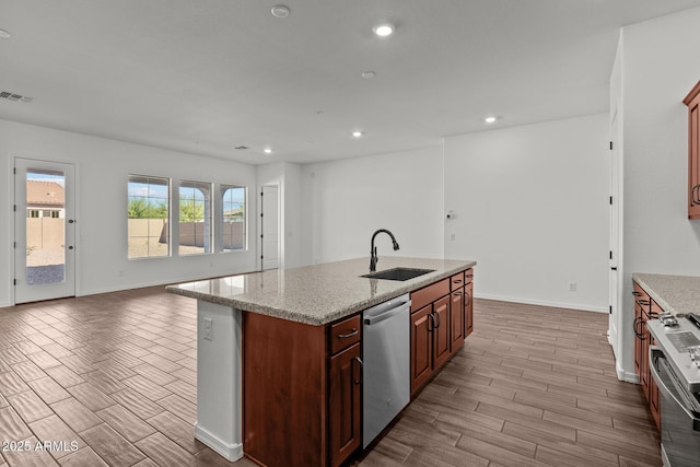 12308 W Parkway Ln, Avondale, AZ 85323 - kitchen with a sink, appliances with stainless steel finishes, baseboards, recessed lighting, and open floor plan