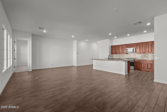 12308 W Parkway Ln, Avondale, AZ 85323 - unfurnished living room with dark wood-style floors, recessed lighting, a sink, and baseboards