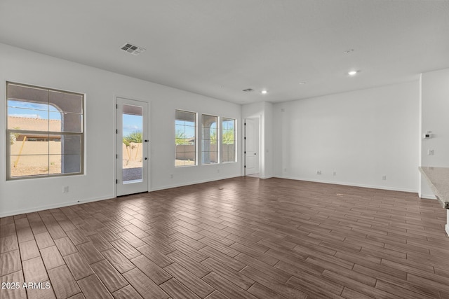 12308 W Parkway Ln, Avondale, AZ 85323 - empty room with wood finished floors, recessed lighting, and baseboards