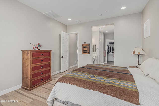 bedroom with recessed lighting, baseboards, light wood-type flooring, and visible vents