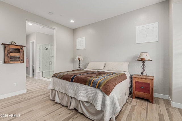 bedroom with baseboards, recessed lighting, connected bathroom, and wood finished floors