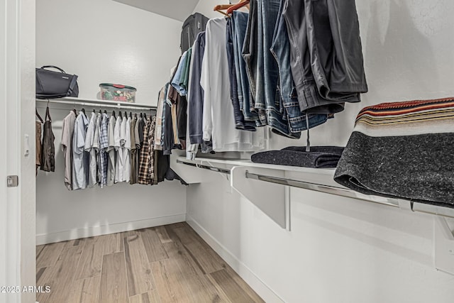 spacious closet with wood finished floors