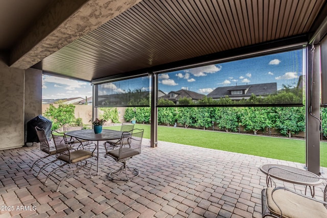 view of patio with a fenced backyard and outdoor dining space