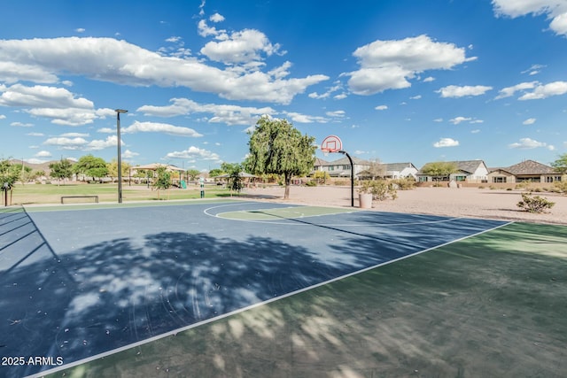 view of sport court featuring a residential view and community basketball court
