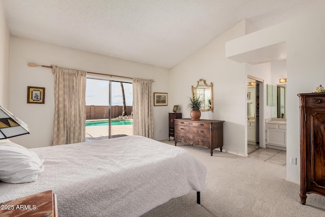 bedroom with vaulted ceiling, access to outside, light colored carpet, and a textured ceiling