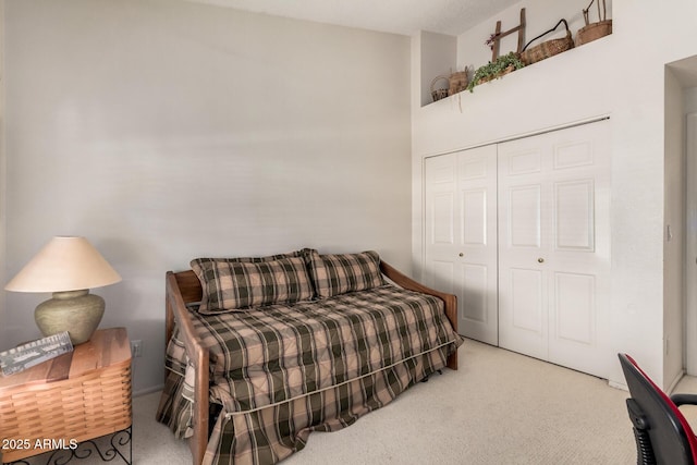 carpeted bedroom featuring a closet