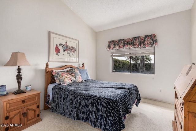 bedroom featuring lofted ceiling and light colored carpet