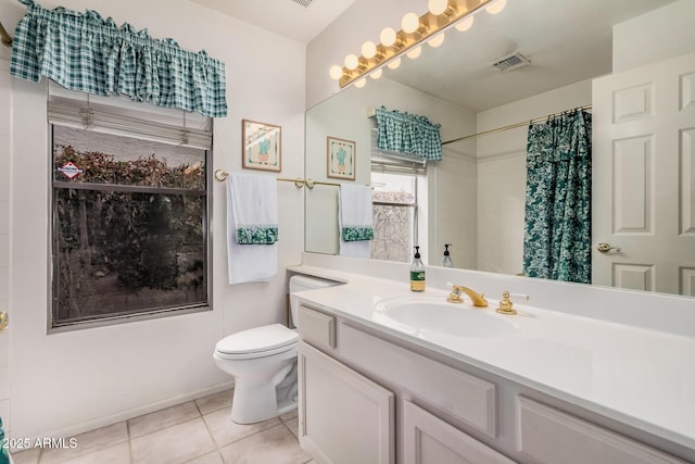 bathroom with vanity, visible vents, curtained shower, tile patterned floors, and toilet