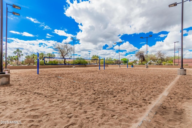 view of home's community featuring volleyball court