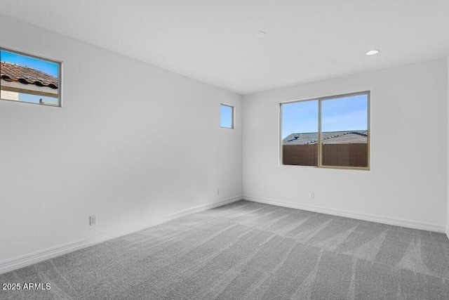 unfurnished room with carpet, baseboards, and recessed lighting