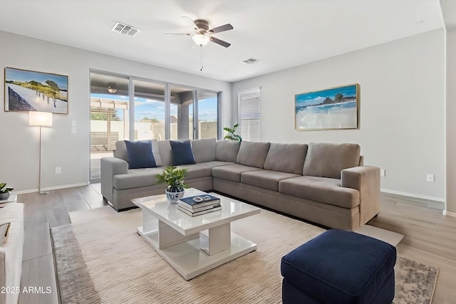 25876 N 162nd Dr, Surprise, AZ 85387 - living area featuring a ceiling fan and light wood-style flooring