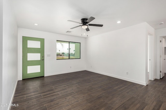 unfurnished room featuring dark wood-style floors, baseboards, and recessed lighting