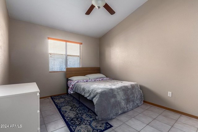 tiled bedroom featuring ceiling fan and lofted ceiling