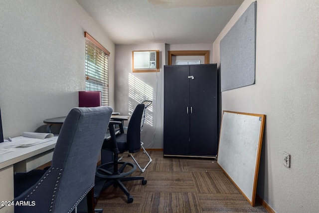 home office featuring a textured ceiling and a wall mounted AC