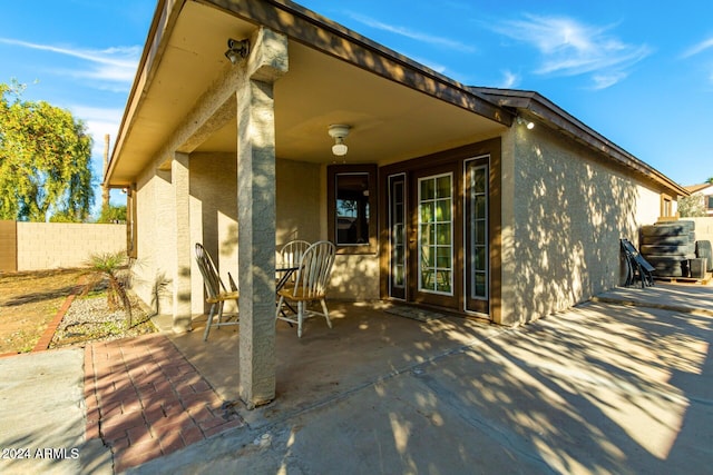 property entrance featuring a patio area