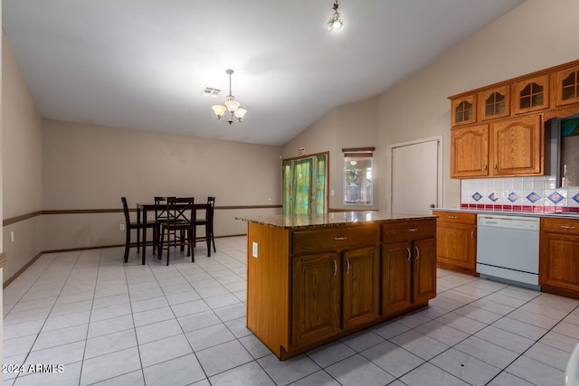 kitchen featuring dishwasher, a center island, a notable chandelier, decorative light fixtures, and light tile patterned floors