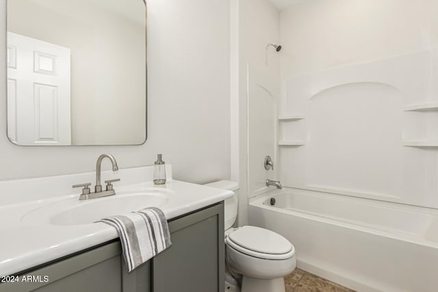 full bathroom featuring vanity, bathing tub / shower combination, toilet, and tile patterned flooring