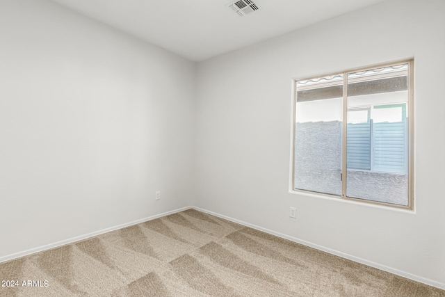 unfurnished room featuring carpet