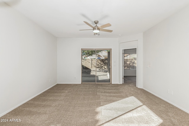 unfurnished room featuring carpet floors and ceiling fan