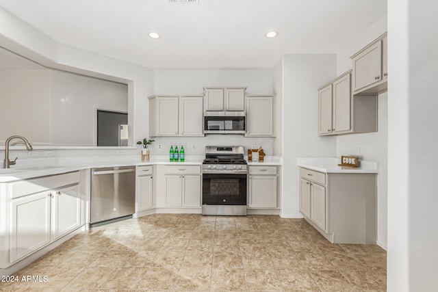 kitchen with appliances with stainless steel finishes and sink