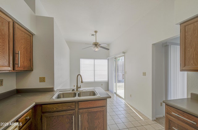 522 W Dennis Ct, Tempe, AZ 85283 - kitchen with ceiling fan, a peninsula, light tile patterned floors, and light countertops