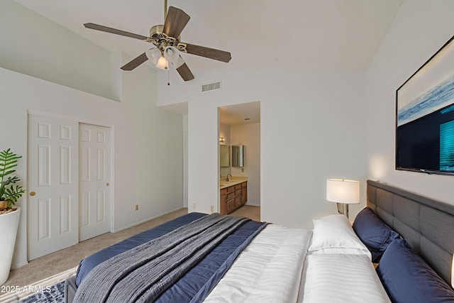 522 W Dennis Ct, Tempe, AZ 85283 - bedroom featuring light carpet, high vaulted ceiling, ceiling fan, a closet, and ensuite bath