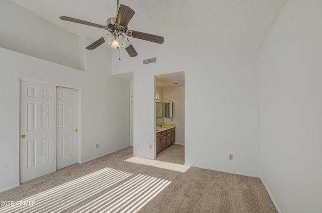 522 W Dennis Ct, Tempe, AZ 85283 - unfurnished bedroom with light carpet, a closet, high vaulted ceiling, a ceiling fan, and ensuite bathroom