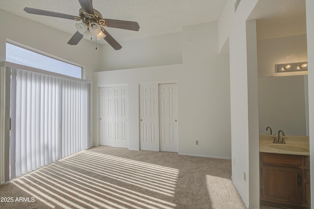 522 W Dennis Ct, Tempe, AZ 85283 - unfurnished bedroom with carpet floors, multiple closets, and a ceiling fan